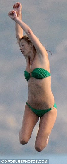 Leaping into action: Lily looks on as new best friend Kate jumps into the water
