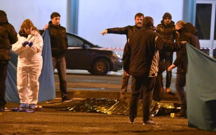 The body is covered as Italian police cordon off an area 