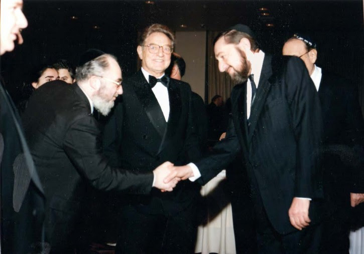 FILE - (L-R) Dr. David Moskovits,President Endowment for Democracy in Eastern Europe, George Soros, Moshe (Paul) Reichman Nov. 1993. This Historic photo taken at a private meeting in connection with the gala to benefit the Endowment for Democracy Dinner established by Dr. David Moskovits that honored George Soros who was at that time partners with Paul Reichmann whose brother Albert Reichmann chaired the Endowment, sponsors of the Masaros Avos School in Budapest, an initiative of the Skulener Rebbe Shlita. (Photo credit: The Friedlander Group)
