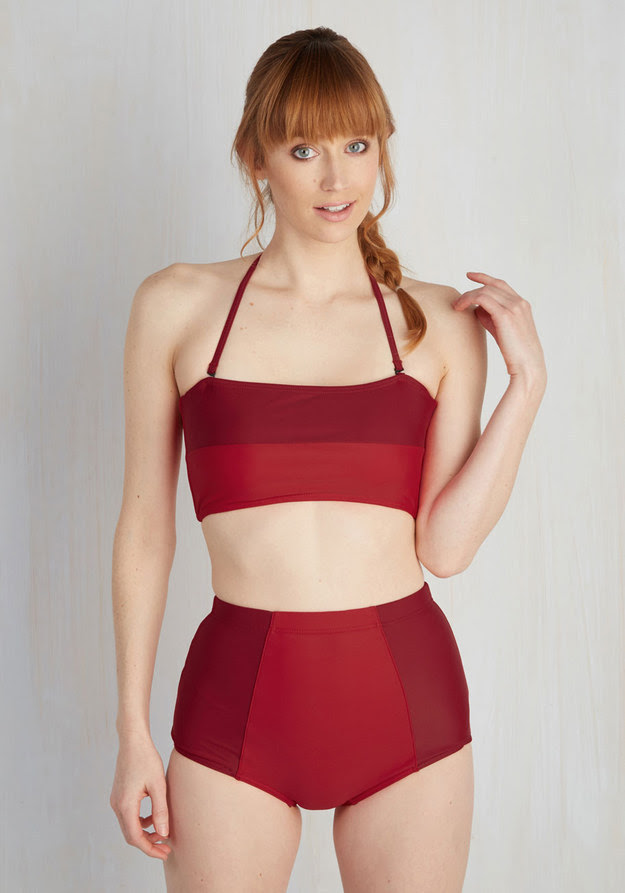 A colorblocked suit in shades of red.