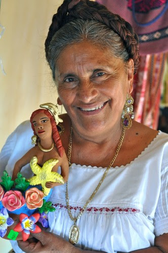 Irene R Aguilar Alcantara and one of her ceramic mermaids 