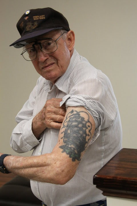 An old hellraiser with my past etched into my body. Faded tattoos telling 