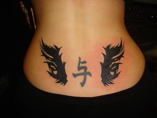 Lower back tribal tattoo
