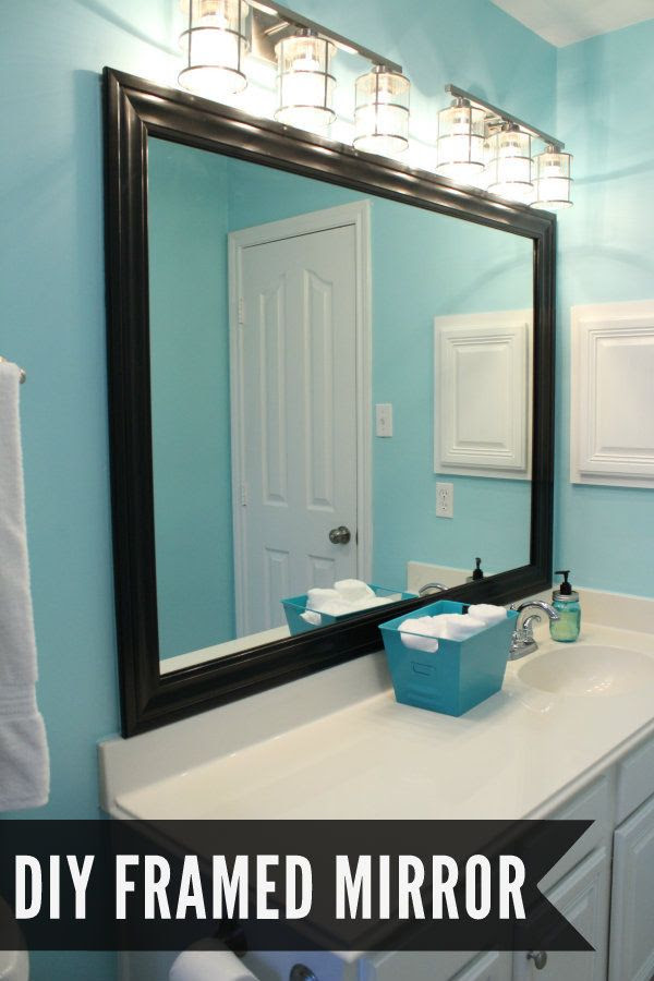I have to paint the one in our old house black to go with my black and pink bathroom  DIY Framed Mirror Tutorial on { lilluna.com }