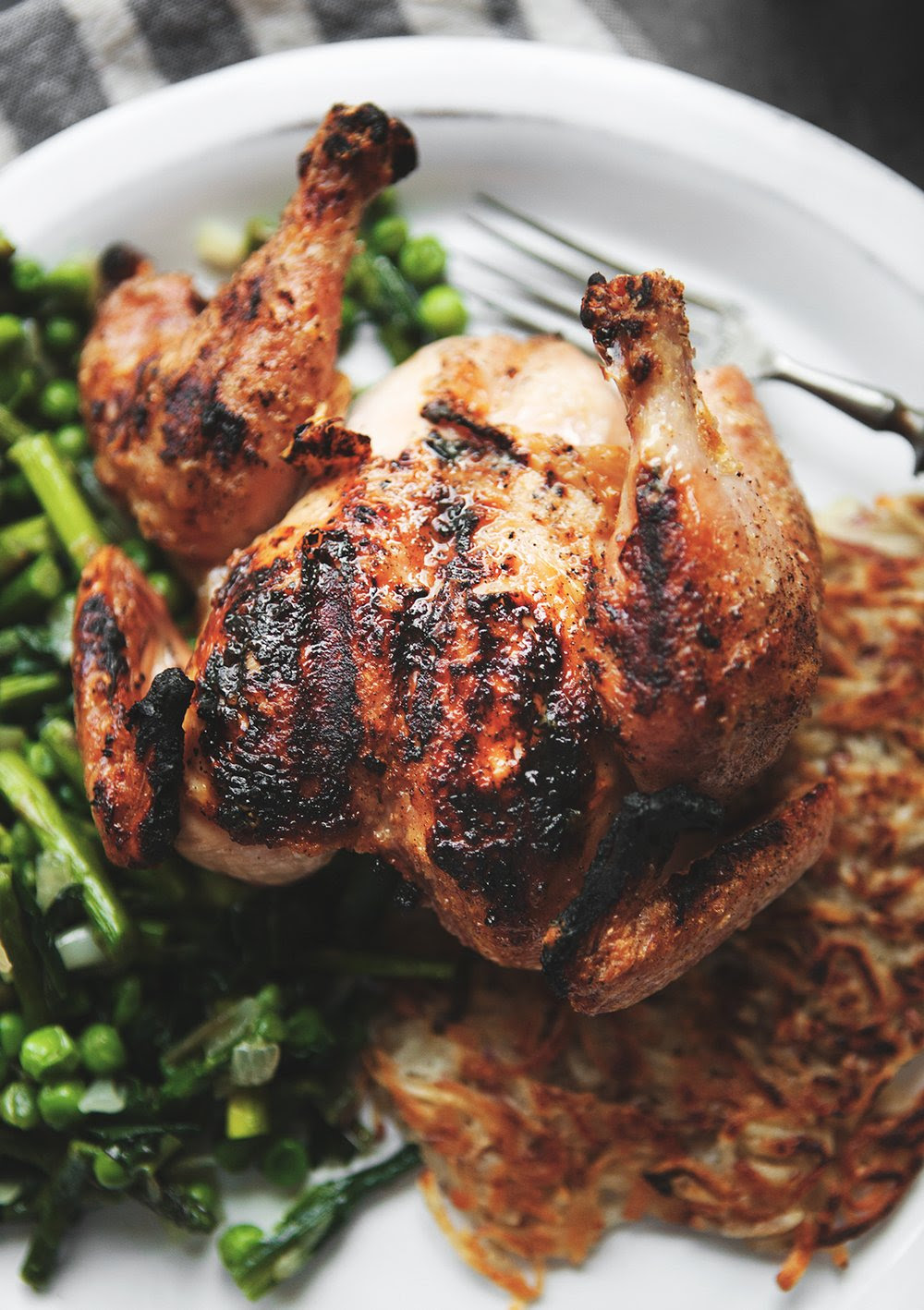 Spatchcock Grilled Cornish Game Hen with Ramp Hash and Latkes — a