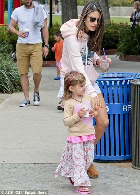 Multi tasker: The supermodel is also mother to baby Noah, who she gave birth to back in May