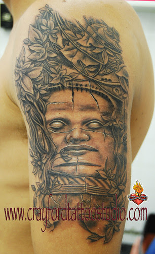 Stone Face Tattoo by The Tattoo Studio. Tattooed by Ray at The Tattoo Studio 