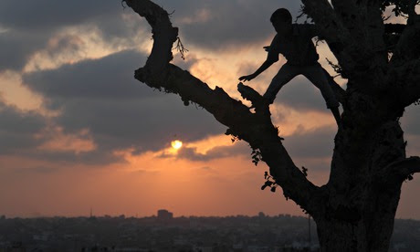 Palestinian boys play Gaza City 18 August 2014