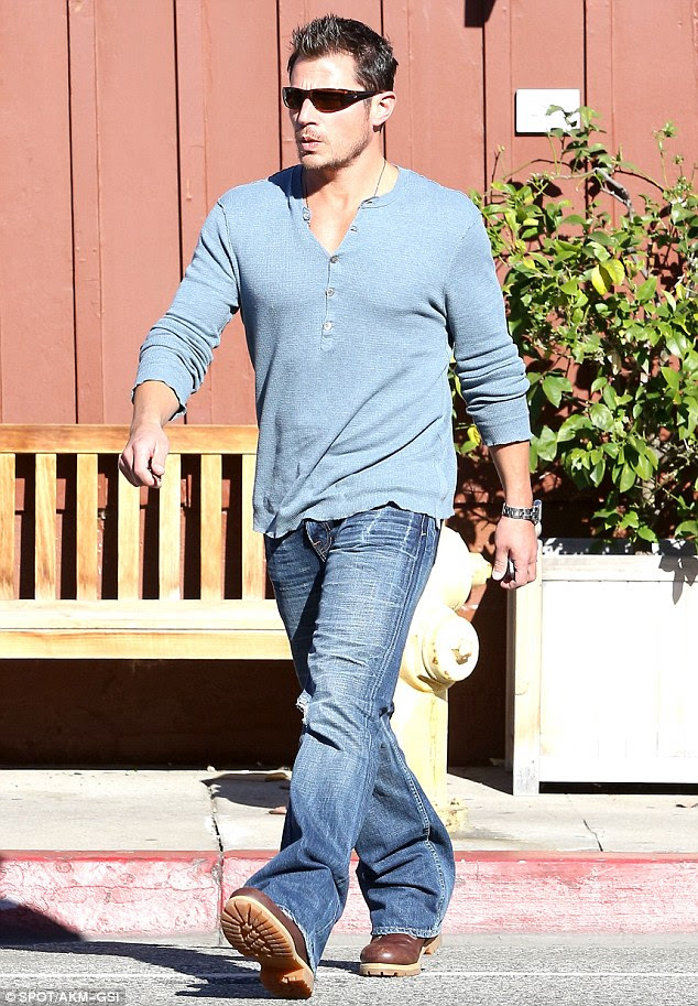 Buff: Nick Lachey crosses the street in Brentwood, California on Monday while out and about