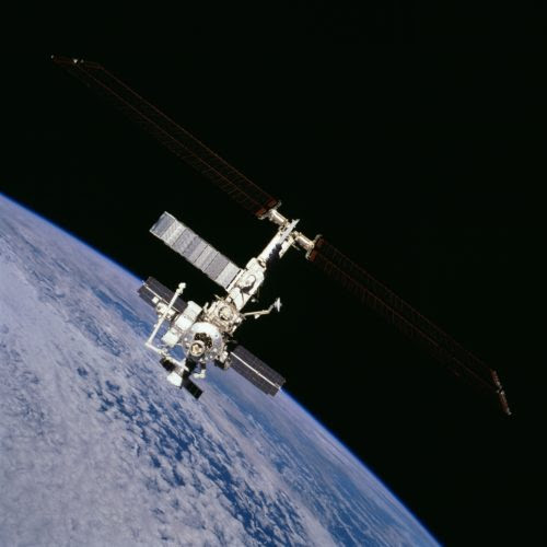 Newly stocked and newly staffed, the International Space Station (ISS) disappears into the blackness as Discovery departs. Photo Credit: NASA
