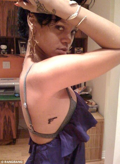 Secret weapon: Rihanna unveils controversial new gun tattoo