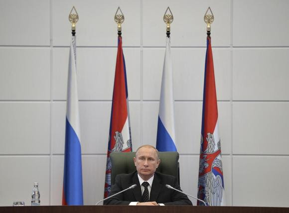 Russia's President Vladimir Putin chairs a meeting with senior military officials at the Defense Ministry's control room in Moscow in Moscow, December 19, 2014. REUTERS/Alexei Druzhinin/RIA Novosti/Kremlin