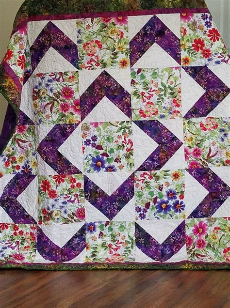 Floral prints can add an extra touch to your flower quilt. beautiful floral example of walk about quilt lap quilt patterns