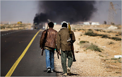 Opposition fighters on the road near Sidra, six miles west of Ras Lanuf, Libya, on Thursday.