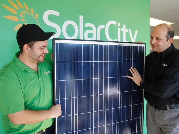 Operations manager Russell Pierson, left, and Leon Keshishian, regional vice president, are showing Chinese-made solar panels at their office in Blackwood, N.J. (AKIRA SUW/Staff Photographer)