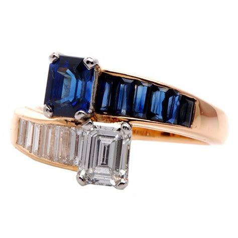 This solitaire diamond ring is handmade from 14k rose gold with a 0.50 carat blue diamond. Oscar Heyman 2.45 ct Diamond Sapphire Gold Bypass Ring at