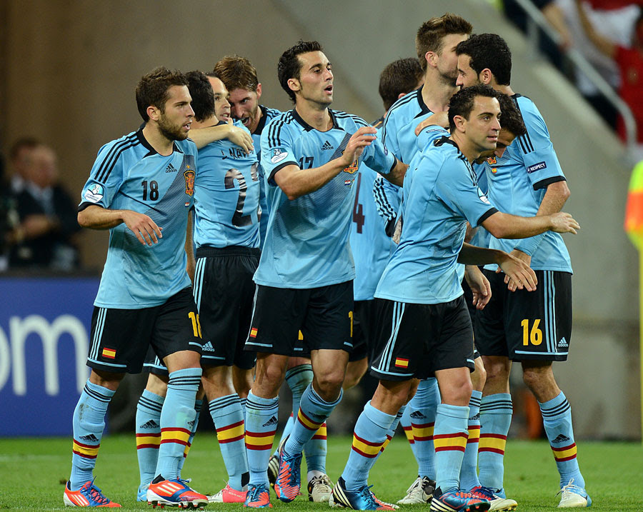 Spain players celebrate after Jesus Navas scores their side's winner,