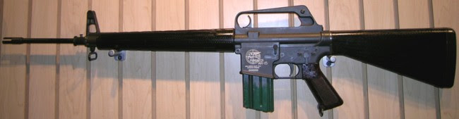 First model ArmaLite Ar-15 rifle, with original 25-round magazine. Note the position of charging handle