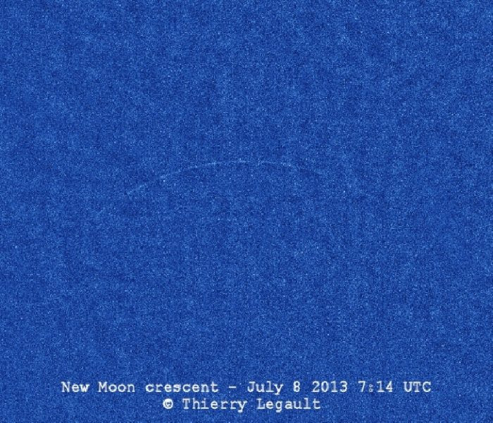 View larger. | Youngest possible lunar crescent, with the moon's age being exactly zero when this photo was taken — at the precise moment of the new moon - at 07:14 UTC on July 8, 2013. Image by Thierry Legault. Visit his website. Used with permission.