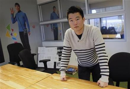Tim Chae poses for a photo in a conference room where he attends '500 Startups,' a crash course for young companies run by a funding firm of the same name, in Mountain View February 16, 2012. Chae, 20, a Babson College dropout, has raised a small amount of capital for his company, Post Rocket, is seeking more and is hoping the upcoming Facebook IPO will help investors look more kindly on all young entrepreneurs. Photo taken February 16, 2012.  REUTERS-Robert Galbraith
