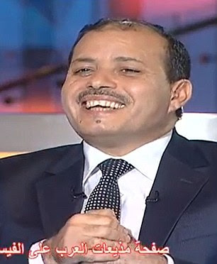 Minister of Information Salah Abdel Maksud is caught on camera telling a Dubai TV news show host: 'I hope your questions won't be as hot as you.' 