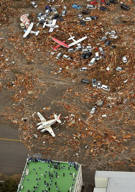 tsunami_hits_airport_in_sendai_japan tsunami_hits_airport_in_sendai_japan