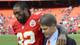 Kansas City Chiefs wide receiver Dwayne Bowe (82) and chairman Clark Hunt walk off the field after the game against the Carolina Panthers at Arrowhead Stadium.