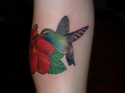 beautiful colorful hummingbird tattoo on flower