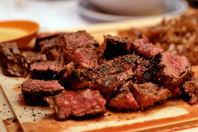 Ribeye Steak served with onion salad and wedges