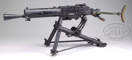 Schwarzlose M1907/12 machine gun on standard Austrian tripod; spade grips are in ready position, and a shoulder stock is attached.