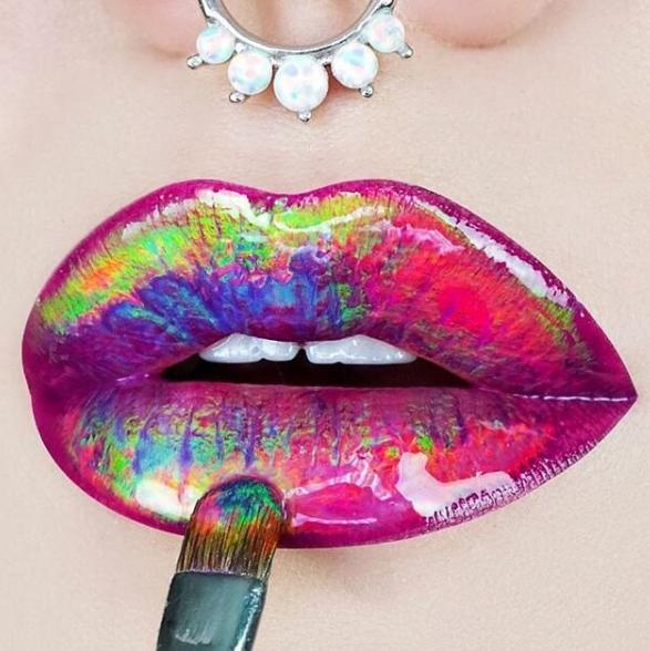 You guys, regular ol' lipstick can be so boring. Which is why the latest ~beauty thing~ errrrybody's freaking out about is HOLOGRAM LIPS.