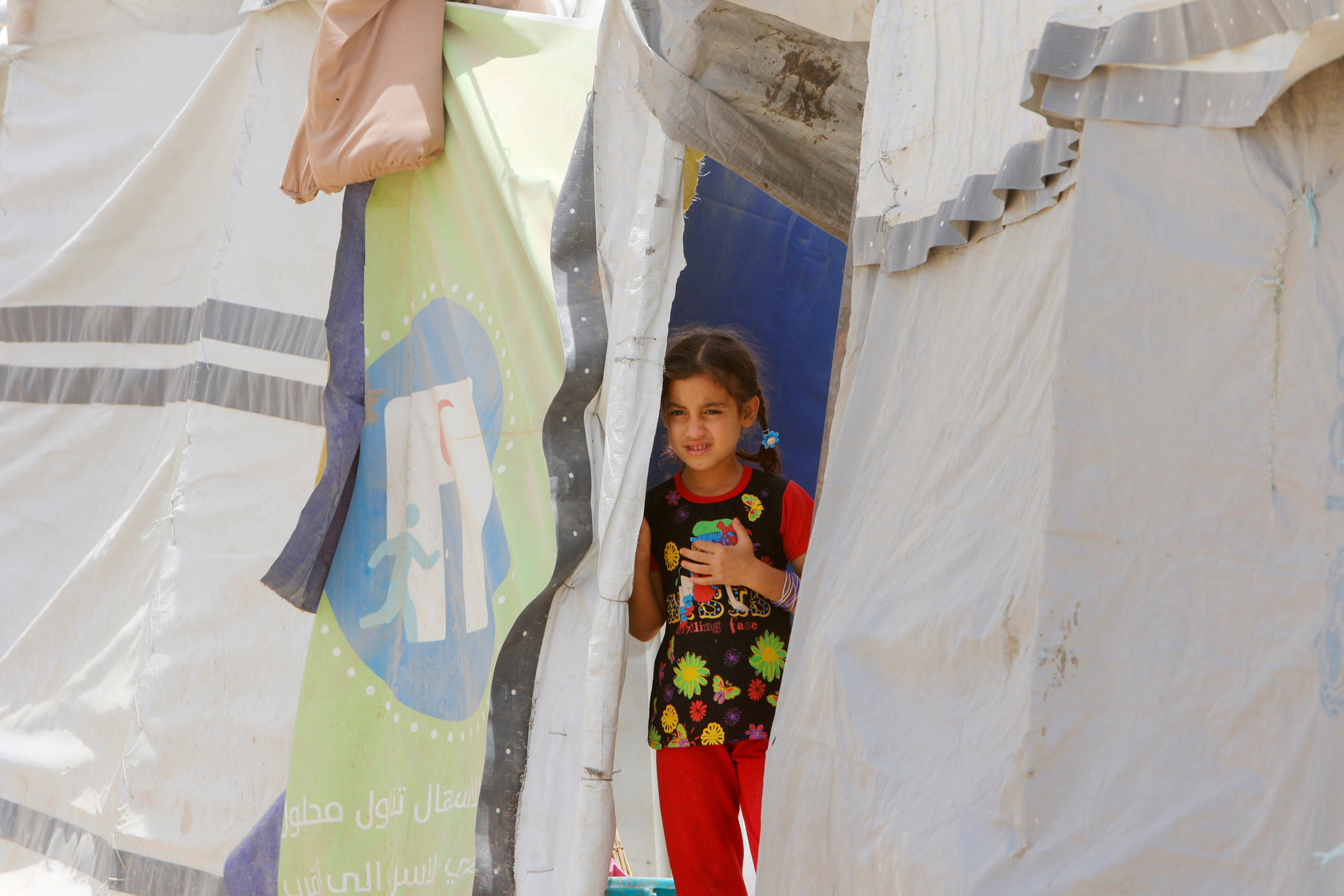 An Iraqi girl who fled from of Islamic State violence, is seen during World Refugee Day celebrations at Al-salam refugee camp in Baghdad, Iraq, June 20, 2016. 