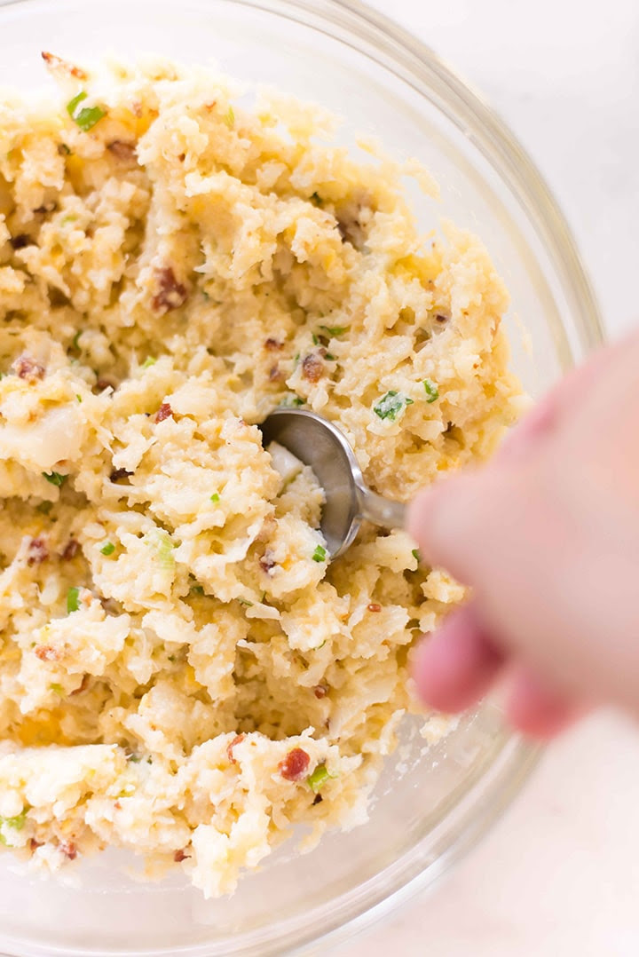 Mixing bowl with everything mixed together and ready to shape into cauliflower tots.
