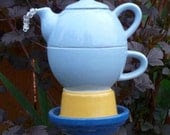 Teapot garden sculpture blue and yellow totem