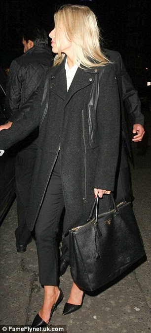 Cool, calm and collected: The Saturdays singer looked typically chic, teaming black cigarette pants with a white blouse, a zip-detail coat and stiletto heels