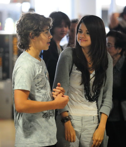 Selena Gomez And Co-Star Jake Austin Stay Close At LAX