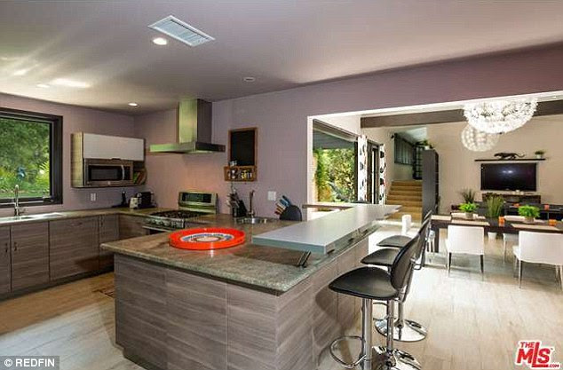 Laid back: While the kitchen is small, it is functional with a breakfast bar that can serve as a place for casual eating or a beer or two after a big day at the beach