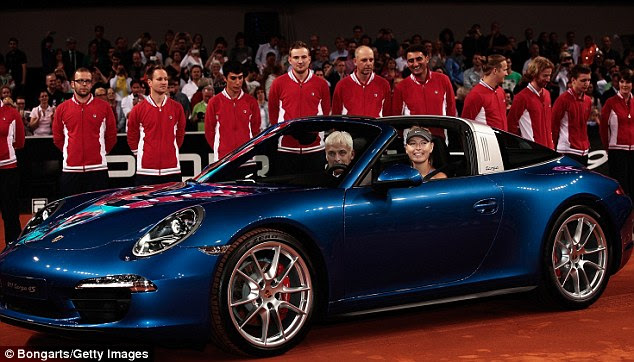 All smiles: Sharapova posing inside her new car