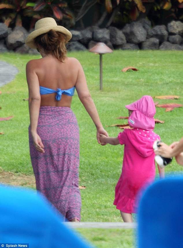 Soak up the sun: The daughter of the late great Elvis Presley had fun relaxing with husband Michael Lockwood and their four-year-old twin girls Finley and Harper