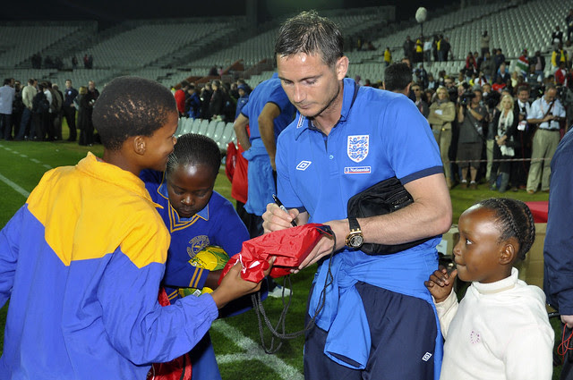 Frank Lampard signs memorabilia for SA schoolchildren by DFID - UK Department for International Development