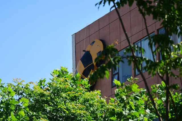 ‘Luxury car’ races up building, entertainment news