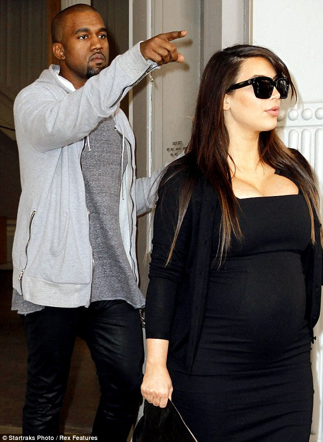Spotted: Kanye pointed at his pal when he saw him approaching as he and Kim left a store together