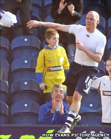 Iain Hume throws his shirt as he celebrates scoring Preston's winner