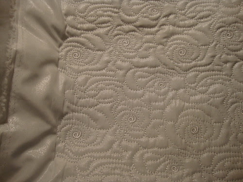 White poly outerwear (layer of batting in between)