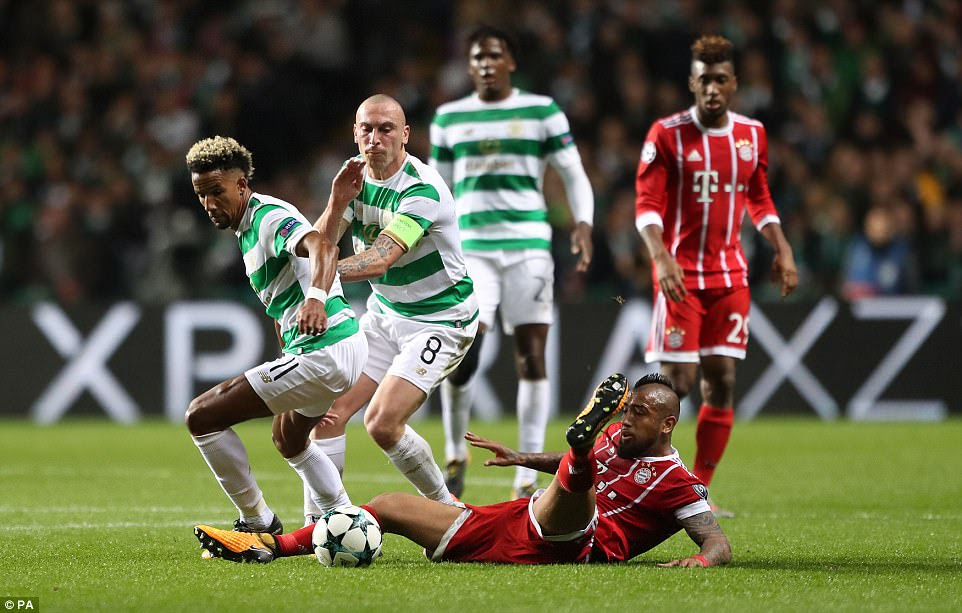 Celtic forward Scott Sinclair evades the challenge of midfielder Vidal as they continue their search for an equalising goal