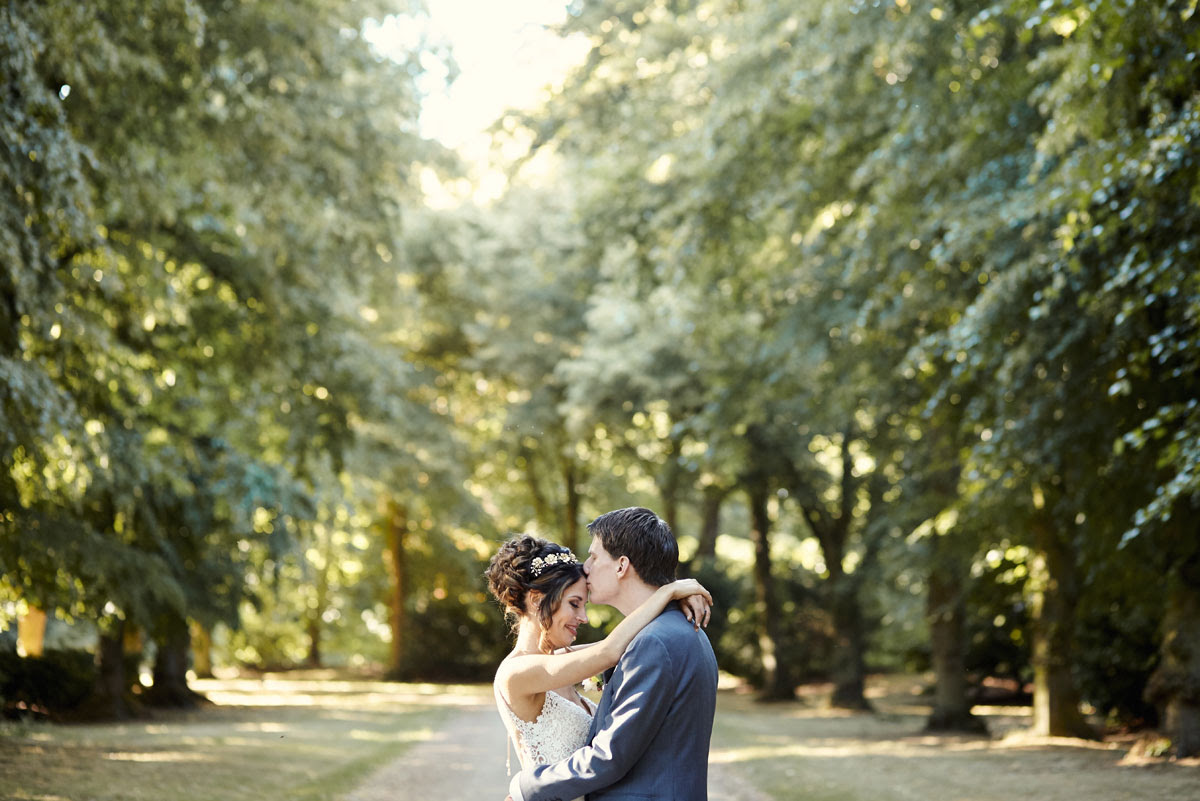 Bride and groom in evening sunlight at Lanwades Hall Wedding Photos - helloromancephotography.com