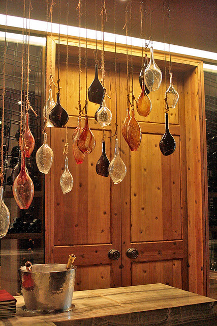 Little glass pieces add character to the place. The heavy wooden doors are imported from Spain.
