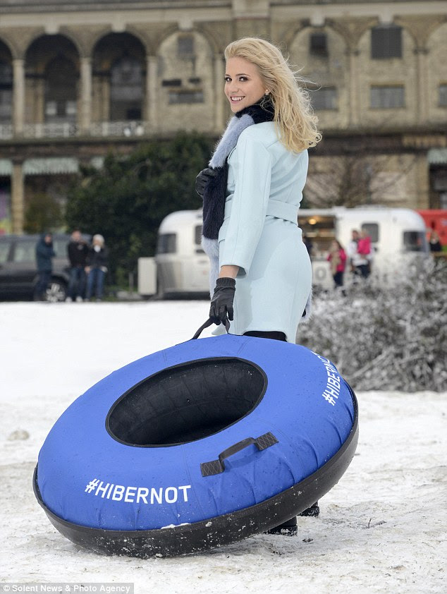 Wrapped up: The singer looked cute in her pastel coat as she got ready to speed down the 'snowy' slope at Alexandra Palace Park