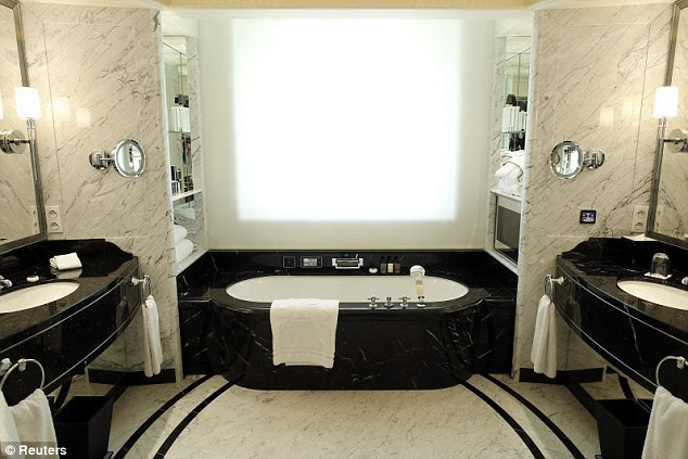 And relax ... Inside a a marble bathroom in a one of the rooms. A penthouse suite costs £20,000 a night