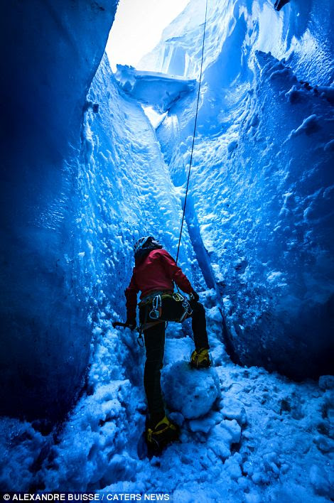 Hulya Vassail climbs out of a moulin ice cave